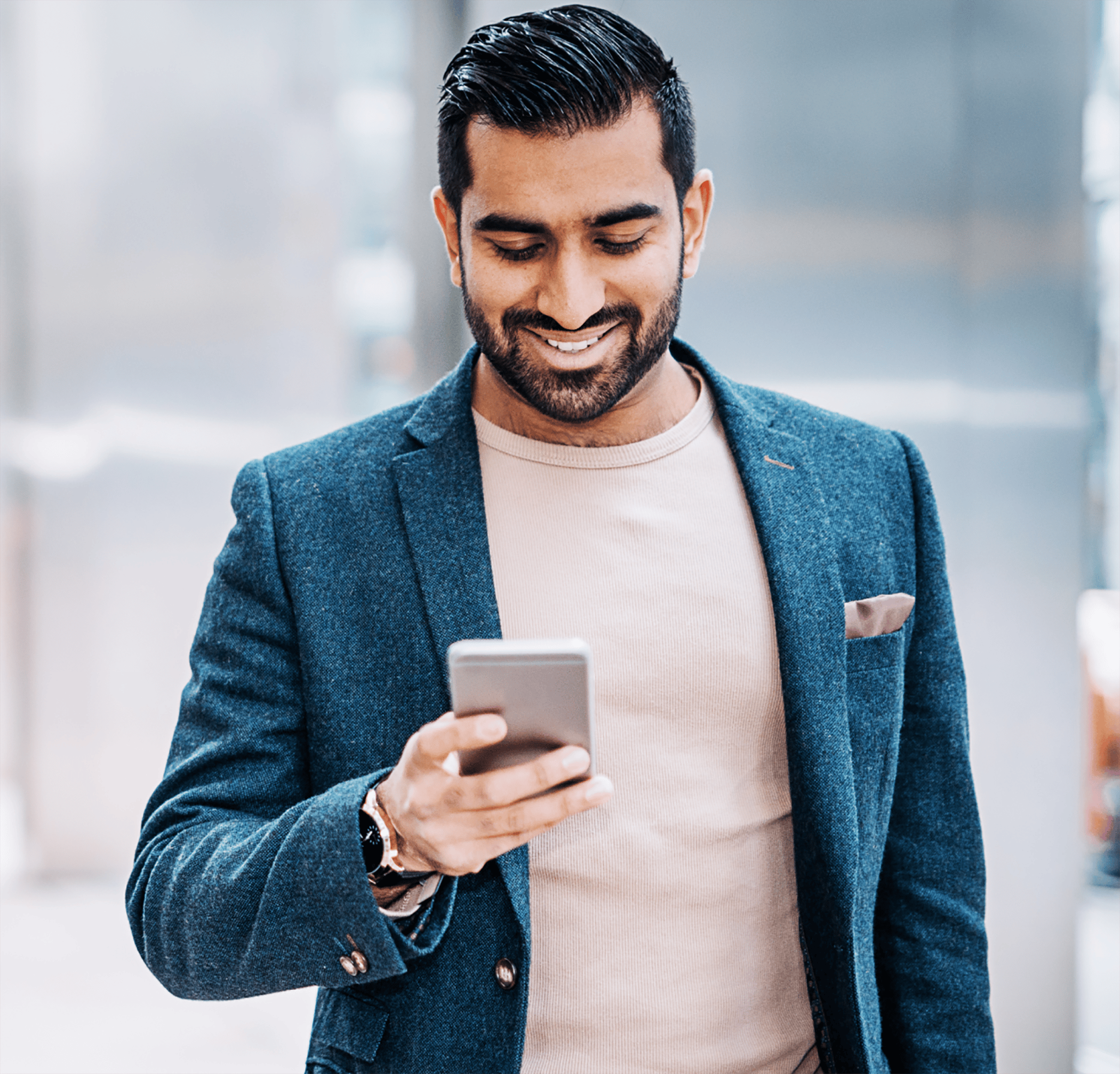 Man walking and texting on a phone outside